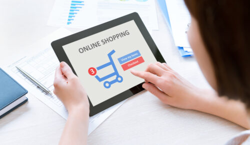 Business person makes a purchase through online shopping application on a modern digital tablet