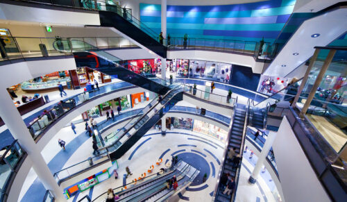 Modern shopping mall interior. Busy sale time