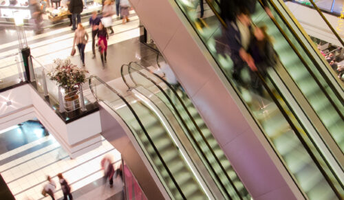 People in the multilevel mall, motion blurred
