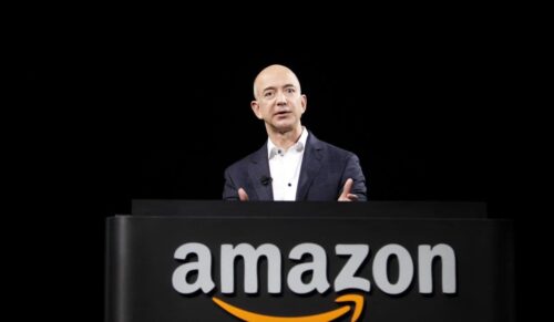 FILE-In this Thursday, Sept. 6, 2012, file photo, Jeff Bezos, CEO and founder of Amazon, speaks at the introduction of the new Amazon Kindle Fire HD and Kindle Paperwhite personal devices, in Santa Monica, Calif. Amazon reported third-quarter results below Wall Street’s expectations on Thursday, Oct. 25, 2012, including a large loss that was weighed by its stake in its online deals service LivingSocial and continued investments in technology and distribution centers to grow its business.  (AP Photo/Reed Saxon)