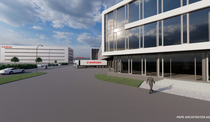 Visualisierung des neuen Logistik-Komplexes der Wortmann KG: rechts das Paletten-Hochregallager, hinten links das neue Shuttle-Lager. Die Gebäude werden über eine Brücke mit Förderbändern verbunden. (Visualisierung: Wortmann KG)